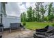 Scenic views of lush greenery enhance this backyard's serene appeal, perfect for entertaining or unwinding at 348 Zocalo Dr, Gastonia, NC 28056