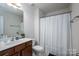 Functional bathroom with a vanity, mirror, toilet, and shower with curtain at 348 Zocalo Dr, Gastonia, NC 28056