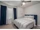 Cozy bedroom featuring a ceiling fan, window, and stylish blue bed frame at 348 Zocalo Dr, Gastonia, NC 28056