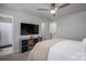 Bedroom featuring mounted TV and shelves for storage in neutral tones at 348 Zocalo Dr, Gastonia, NC 28056