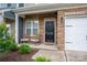 Inviting front porch with charming rocking chairs and classic brick accents at 348 Zocalo Dr, Gastonia, NC 28056