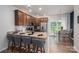 Eat-in kitchen featuring a breakfast bar with granite countertops and stainless appliances at 348 Zocalo Dr, Gastonia, NC 28056