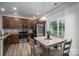 Cozy eat-in kitchen featuring stainless steel appliances and wood cabinets at 348 Zocalo Dr, Gastonia, NC 28056