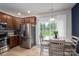 Eat-in kitchen featuring stainless steel appliances, wood cabinets, and a bright window at 348 Zocalo Dr, Gastonia, NC 28056