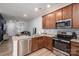Open concept kitchen with stainless steel appliances and view to living room at 348 Zocalo Dr, Gastonia, NC 28056
