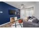 Cozy living room with a dark blue accent wall and modern decor at 348 Zocalo Dr, Gastonia, NC 28056