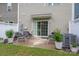 Inviting patio area with comfortable seating and a well-manicured backyard at 348 Zocalo Dr, Gastonia, NC 28056