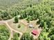 Picturesque cabin, garage and land seen from an aerial view amidst a lush green forest at 362 Sandburg Rd, Union Grove, NC 28689
