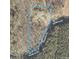 Aerial view of a property with a home, a shed, and boundries on a tree covered lot near Sandburg Rd at 362 Sandburg Rd, Union Grove, NC 28689