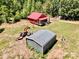 Aerial view of a red home, metal shed, and green lawn surrounded by lush trees at 362 Sandburg Rd, Union Grove, NC 28689