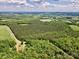 Extensive forest views from an aerial perspective featuring a cozy cabin and open acreage at 362 Sandburg Rd, Union Grove, NC 28689