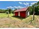 Exterior rear of a red home with a metal roof and wooden support beams at 362 Sandburg Rd, Union Grove, NC 28689