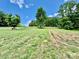 Expansive, tree-lined land with gentle slopes and a sense of peaceful seclusion at 362 Sandburg Rd, Union Grove, NC 28689