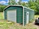 Metal outbuilding with a roll-up door and standard door, located on a grass lot at 362 Sandburg Rd, Union Grove, NC 28689