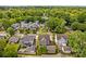 An aerial view displaying the house within a tree-filled neighborhood at 376 Delburg St, Davidson, NC 28036
