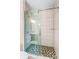Modern bathroom featuring a glass shower door and hexagon tile flooring at 376 Delburg St, Davidson, NC 28036