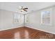 Cozy bedroom with wood floors and multiple windows offering plenty of natural light at 376 Delburg St, Davidson, NC 28036
