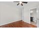 Bedroom with hardwood floors, ceiling fan, and ensuite bathroom at 376 Delburg St, Davidson, NC 28036