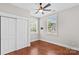 Bedroom featuring hardwood floors, closet, and natural light at 376 Delburg St, Davidson, NC 28036