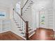 Bright foyer with hardwood floors, staircase, and natural light from large window at 376 Delburg St, Davidson, NC 28036