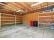 Spacious garage interior with unfinished wood and a concrete floor, equipped with multiple shelves at 376 Delburg St, Davidson, NC 28036