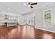 Bright open floor plan with hardwood floors, neutral paint, and windows letting in natural light at 376 Delburg St, Davidson, NC 28036