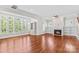 A bright living room with hardwood floors, fireplace and a large window at 376 Delburg St, Davidson, NC 28036