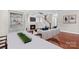 Cozy staged living room with dining area, fireplace, hardwood floors and neutral tones at 376 Delburg St, Davidson, NC 28036