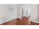 Bright living room with hardwood floors and classic white trim, adjacent to the stairs at 376 Delburg St, Davidson, NC 28036