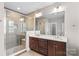 Modern main bathroom with a glass-enclosed shower and a spacious double sink vanity at 376 Delburg St, Davidson, NC 28036