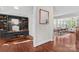 View of the office, and dining room featuring an open-concept design with hardwood floors and natural light at 376 Delburg St, Davidson, NC 28036
