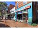 Charming street featuring small shops with brick sidewalks and vintage signage at 376 Delburg St, Davidson, NC 28036