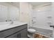 Bathroom featuring a gray vanity, tub-shower combo, and luxury vinyl plank flooring at 4116 Lurelin Ln, Charlotte, NC 28262