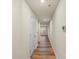 Hallway with wood-look floors and white walls with view of the backyard at 4116 Lurelin Ln, Charlotte, NC 28262