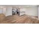 Modern open-concept kitchen featuring gray cabinets and stainless steel appliances, perfect for entertaining at 4116 Lurelin Ln, Charlotte, NC 28262
