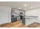 Modern kitchen with stainless steel appliances, gray cabinets, and granite countertops at 4116 Lurelin Ln, Charlotte, NC 28262