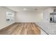 Spacious living room featuring hardwood floors, kitchen bar, and lots of natural light at 4116 Lurelin Ln, Charlotte, NC 28262