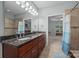 Bathroom showcasing a double vanity, walk-in shower, and a view into the bedroom at 422 Drake Ln, Salisbury, NC 28146