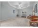 Spacious carpeted bedroom features a tray ceiling with fan and a large window at 422 Drake Ln, Salisbury, NC 28146