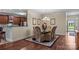 Dining area with a glass table and seating for six adjacent to kitchen and living room at 422 Drake Ln, Salisbury, NC 28146