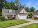 Well-kept home with a two-car garage, cozy front porch, and a manicured front yard at 422 Drake Ln, Salisbury, NC 28146