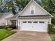 A two-car garage with decorative windows sits at the front of this meticulously kept home at 422 Drake Ln, Salisbury, NC 28146