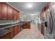Open kitchen layout with stainless steel appliances, granite counters, and breakfast bar at 422 Drake Ln, Salisbury, NC 28146