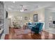 Open concept living room with a tray ceiling, fireplace, and hardwood floors and ample natural light at 422 Drake Ln, Salisbury, NC 28146