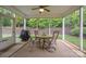 Screened-in porch with outdoor seating and ceiling fan at 422 Drake Ln, Salisbury, NC 28146