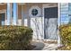 Close-up of a townhome entrance featuring a decorative window and well-maintained landscaping at 4226 Lotts Pl, Rock Hill, SC 29732