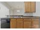 Kitchen features stainless steel sink, laminate countertops, and wood cabinets at 4226 Lotts Pl, Rock Hill, SC 29732