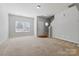 Bright living room with a staircase and a charming decorative window providing ample natural light at 4226 Lotts Pl, Rock Hill, SC 29732