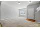 Spacious living area with neutral carpet, a front window and entrance at 4226 Lotts Pl, Rock Hill, SC 29732