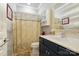Bathroom features a vanity with decorative mirrors, a shower with a curtain, and built-in shelves at 43041 Mimosa Ct, Fort Mill, SC 29707